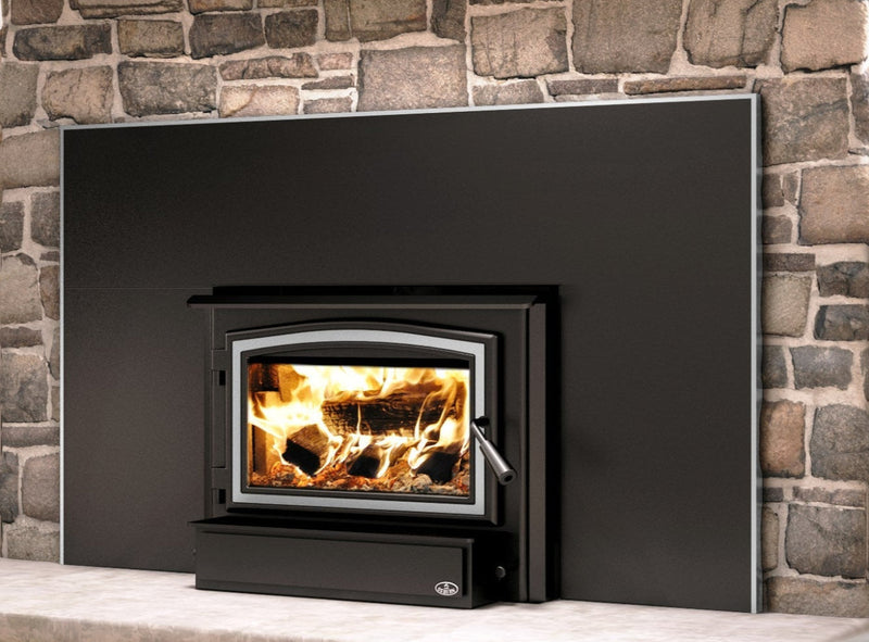 Black fireplace insert with flames inside, set against a stone wall.